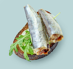 Image showing canned sardines on bread slice