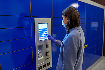 Image showing woman in mask at parcel machine