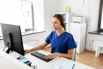 Image showing doctor with headset and computer at hospital