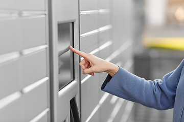 Image showing close up of hand using automated parcel machine