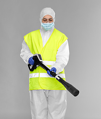 Image showing sanitation worker in hazmat with pressure washer