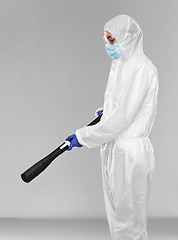 Image showing sanitation worker in hazmat with pressure washer