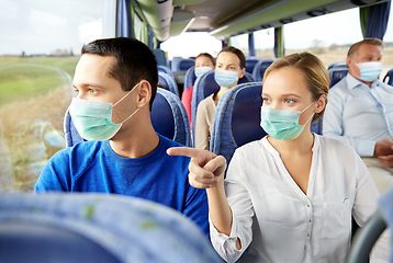 Image showing couple of passengers in masks in travel bus