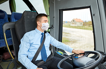 Image showing bus driver in mask talking to microphone