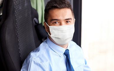 Image showing close up of bus driver in medical mask