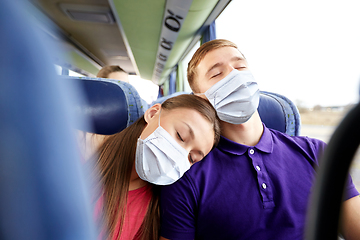 Image showing passengers in masks sleeping in travel bus