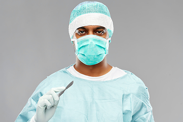 Image showing indian male doctor or surgeon with scalpel