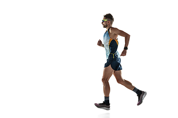 Image showing Triathlon male athlete running isolated on white studio background