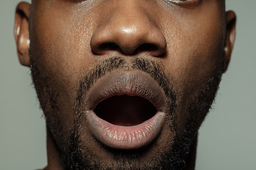 Image showing Close up of face of beautiful african-american young man, focus on mouth