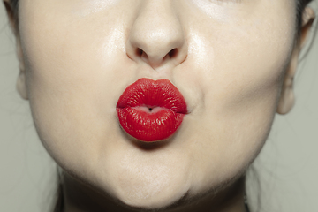 Image showing Close-up female mouth with bright red gloss lips make-up. Cosmetology, dentistry and beauty care, emotions