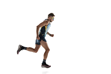 Image showing Triathlon male athlete running isolated on white studio background