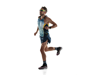 Image showing Triathlon male athlete running isolated on white studio background