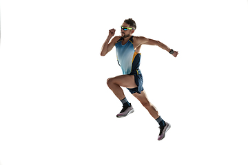 Image showing Triathlon male athlete running isolated on white studio background