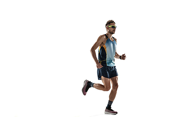 Image showing Triathlon male athlete running isolated on white studio background