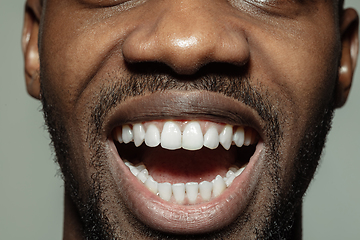 Image showing Close up of face of beautiful african-american young man, focus on mouth