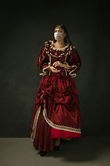 Image showing Medieval young woman as a duchess wearing protective mask against coronavirus spread