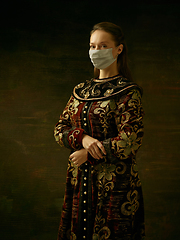 Image showing Medieval young woman as a duchess wearing protective mask against coronavirus spread