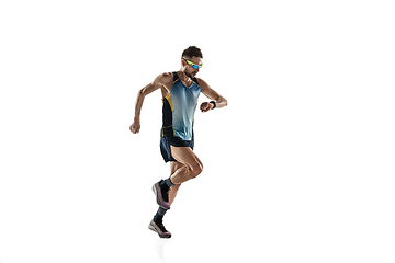 Image showing Triathlon male athlete running isolated on white studio background