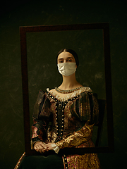 Image showing Medieval young woman as a duchess wearing protective mask against coronavirus spread