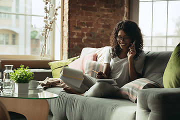 Image showing African-american woman, freelancer during the work in home office while quarantine