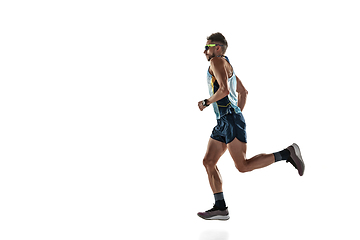 Image showing Triathlon male athlete running isolated on white studio background