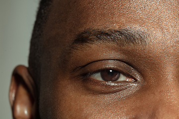 Image showing Close up of face of beautiful african-american young man, focus on eyes