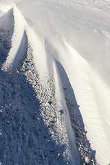 Image showing snowdrifts with dirt