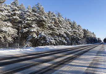Image showing Road in winter ter season. Blue sky in the background