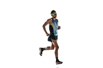 Image showing Triathlon male athlete running isolated on white studio background