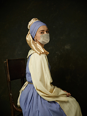 Image showing Medieval young woman as a lady with a pearl earring wearing protective face mask against coronavirus spread