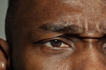 Image showing Close up of face of beautiful african-american young man, focus on eyes