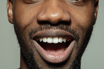 Image showing Close up of face of beautiful african-american young man, focus on mouth