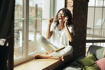 Image showing African-american woman, freelancer during the work in home office while quarantine