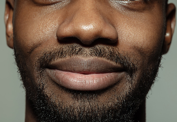 Image showing Close up of face of beautiful african-american young man, focus on mouth