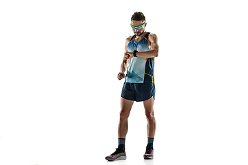 Image showing Triathlon male athlete running isolated on white studio background