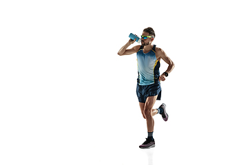 Image showing Triathlon male athlete running isolated on white studio background