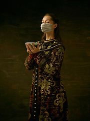 Image showing Medieval young woman as a duchess wearing protective mask against coronavirus spread