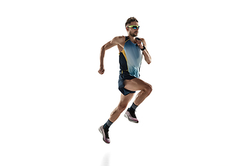 Image showing Triathlon male athlete running isolated on white studio background