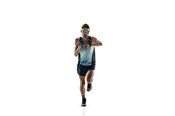 Image showing Triathlon male athlete running isolated on white studio background