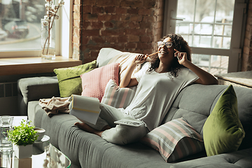 Image showing African-american woman, freelancer during the work in home office while quarantine