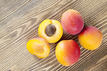 Image showing four ripe apricots