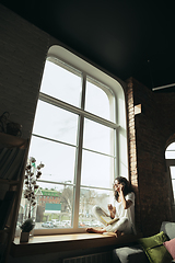 Image showing African-american woman, freelancer during the work in home office while quarantine