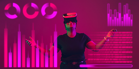 Image showing Woman using interface modern technology and digital layer effect, VR-headset as business, finance, economics strategy concept