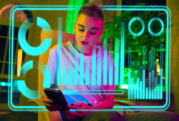 Image showing Woman using interface modern technology and digital layer effect as business, finance, economics strategy concept