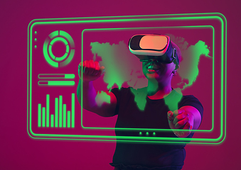 Image showing Woman using interface modern technology and digital layer effect, VR-headset as business, finance, economics strategy concept