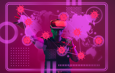 Image showing Woman using interface modern technology and digital layer effect as information of coronavirus pandemic spread