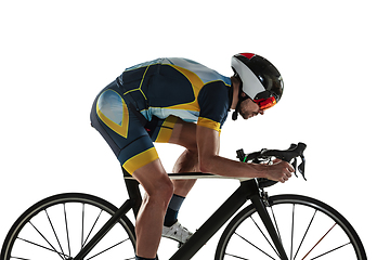 Image showing Triathlon male athlete cycle training isolated on white studio background