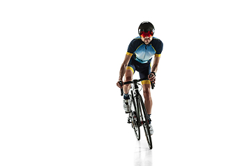 Image showing Triathlon male athlete cycle training isolated on white studio background