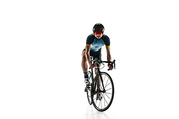 Image showing Triathlon male athlete cycle training isolated on white studio background