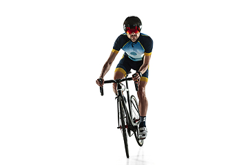 Image showing Triathlon male athlete cycle training isolated on white studio background